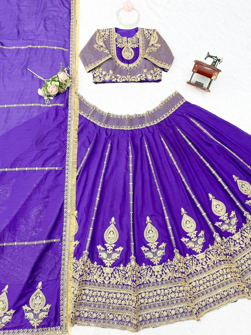 Royal Amethyst Purple Silk Lehenga Choli with Majestic Gold Zari Heritage Motifs and Elaborate Borders
